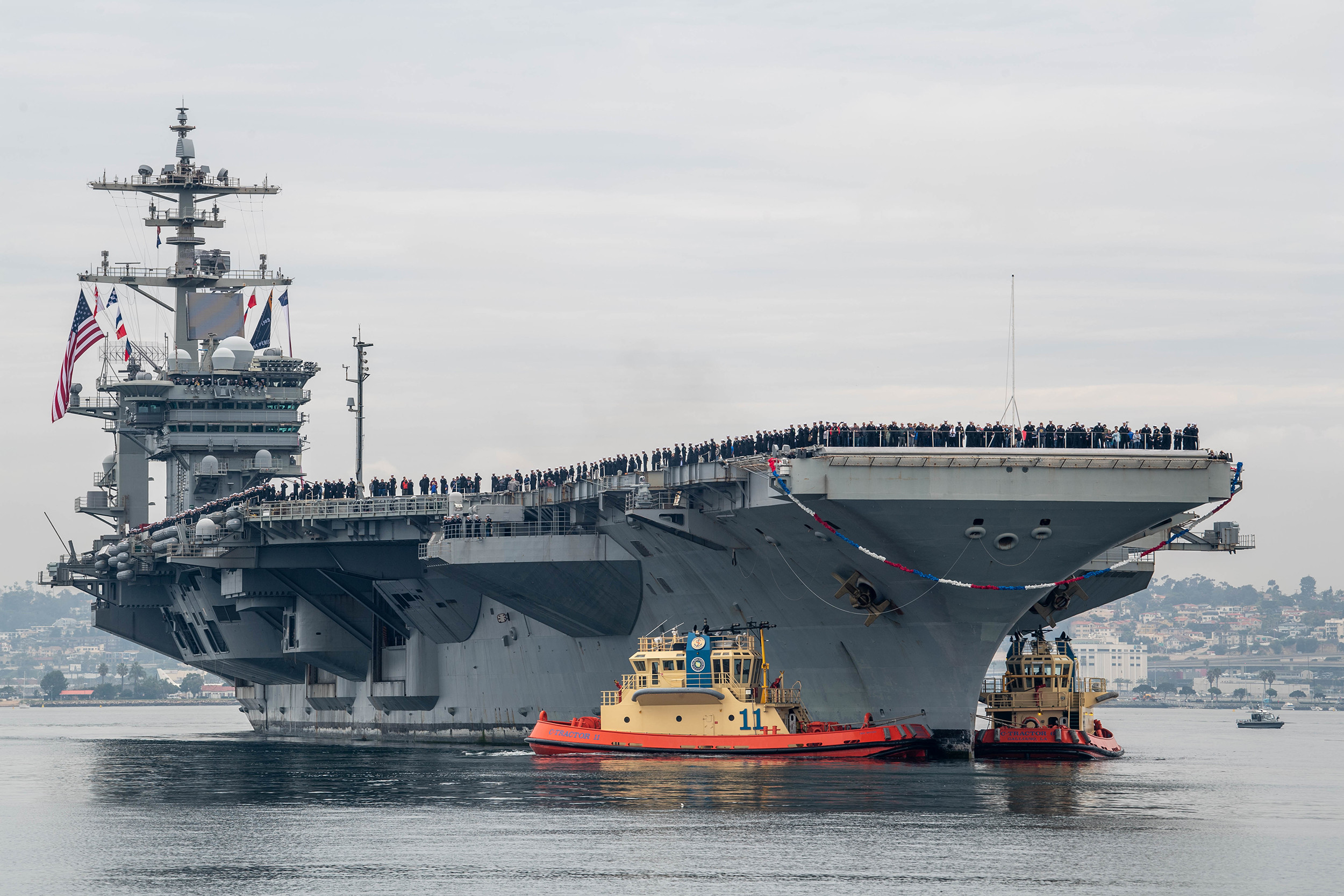 200120-N-HD110-0245SAN DIEGO (Jan. 20, 2020) The Nimitz-class aircraft carrier USS Abraham Lincoln (CVN 72) transits San Diego Bay. Lincoln arrives at Naval Air Station North Island after a 10-month deployment in support of maritime security operations and theater security cooperation efforts in the U.S. 6th, 5th, and 7th Fleet areas of operations. (U.S. Navy photo by Mass Communication Specialist 2nd Class Danielle A. Baker/Released) 